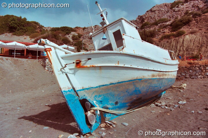 An abandoned boat on the beach at Agios Pavlos. Agios Pavlos, Greece. © 2002 Photographicon