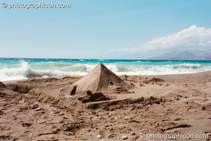 The pyramid that Dominic built on the beach at Agios Pavlos. Agios Pavlos, Greece. © 2002 Photographicon
