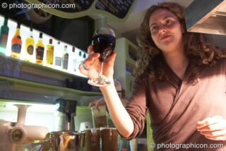 Staff serve behind the cafe counter at the launch party for the inSpiral Lounge organic cafe and multimedia venue. London, United Kingdom. © 2007 Photographicon