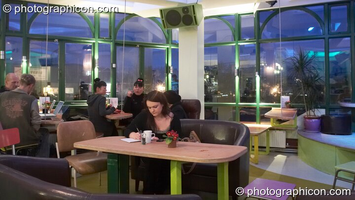 People enjoying the early evening ambience of the inSpiral Lounge organic cafe and multimedia venue. London, United Kingdom. © 2008 Photographicon