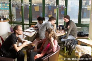 People chat and enjoy the ambience in the inSpiral Lounge organic cafe and multimedia venue. London, United Kingdom. © 2008 Photographicon
