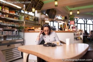 A woman reads a book in the inSpiral Lounge organic cafe and multimedia venue. London, United Kingdom. © 2008 Photographicon