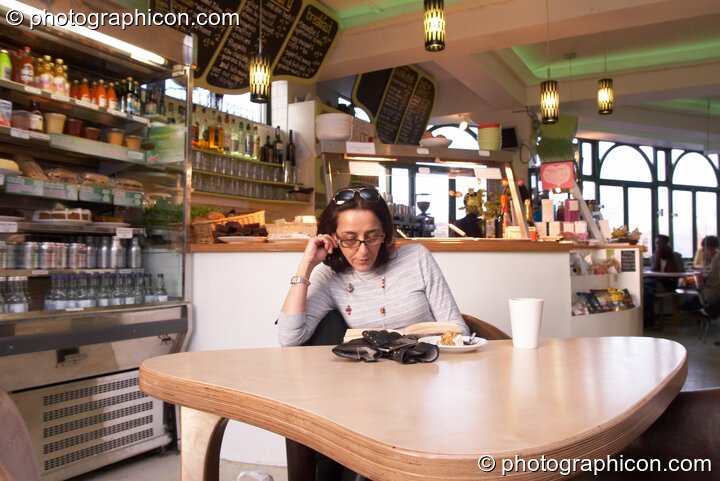 A woman reads a book in the inSpiral Lounge organic cafe and multimedia venue. London, United Kingdom. © 2008 Photographicon