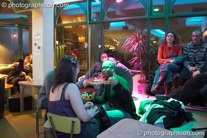 A man gives his approval of the inSpiral Lounge organic cafe and multimedia venue. London, United Kingdom. © 2008 Photographicon
