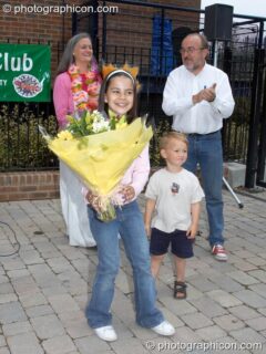Girl with flowers at the opening of Save The World Club's Hundertwasser mosaic. Kingston Upon Thames, United Kingdom. © 2005 Photographicon