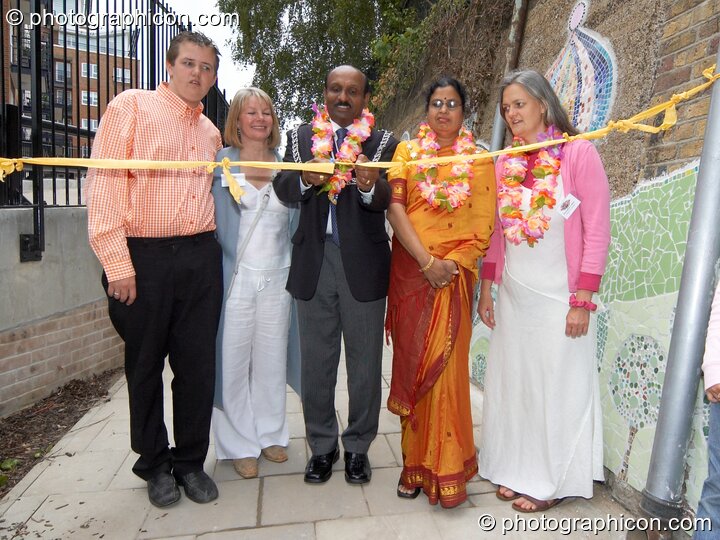 The Mayor prepares to cut the ribbon at the opening of Save The World Club's Hundertwasser mosaic. Left to Right: Aaron Perry, Karen Parry, Councillor Yogan Yoganathan (The Worshipful Mayor of the Royal Borough of Kingston upon Thames), The Lady Mayoress, and Bernadette Vallely. Kingston Upon Thames, United Kingdom. © 2005 Photographicon