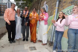 The Mayor prepares to cut the ribbon at the opening of Save The World Club's Hundertwasser mosaic. Left to Right: Aaron Perry, Karen Parry, Councillor Yogan Yoganathan (The Worshipful Mayor of the Royal Borough of Kingston upon Thames), The Lady Mayoress, and Bernadette Vallely. Kingston Upon Thames, United Kingdom. © 2005 Photographicon