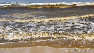 Waves coloured red-brown by leaves breaks on the shore of False Bay, Cape Town - Western Cape, South Africa. Cape Town, South Africa. © 2005 Photographicon