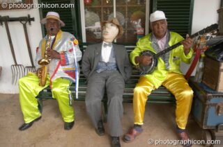Two men and a dummy play music outside the Oom Samie Se Winkel shop, Stellenbosch - Western Cape, South Africa. Stellenbosch, South Africa. © 2005 Photographicon
